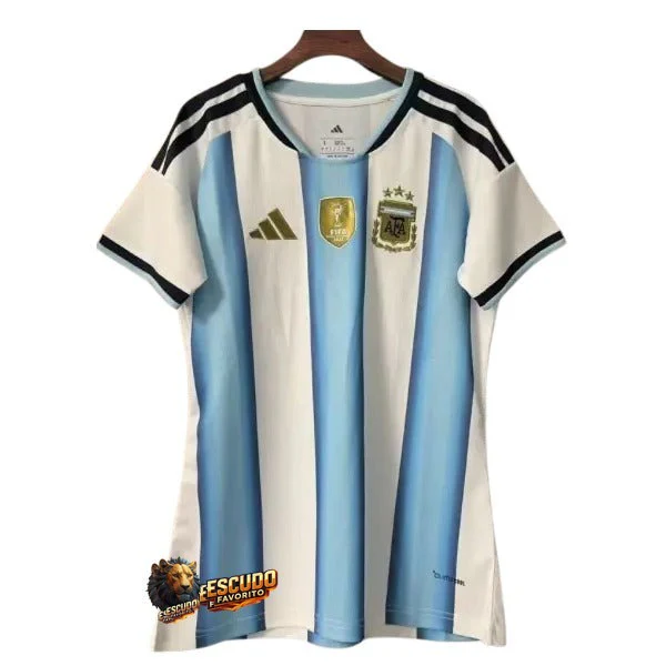 CAMISETA ARGENTINA I MUNDIAL 2026 MUJER CON PARCHE