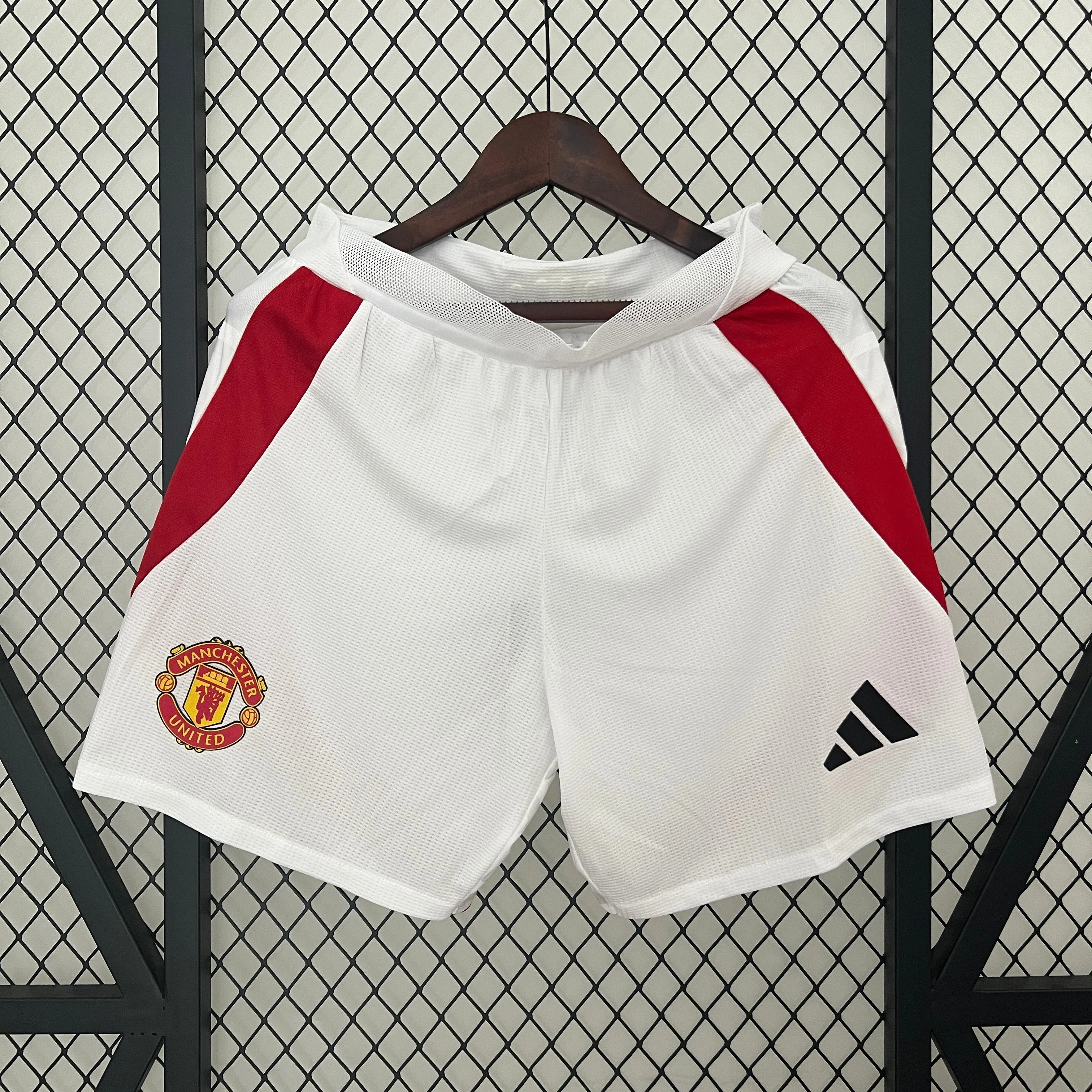 PANTALONES CORTOS MANCHESTER UNITED I 24/25